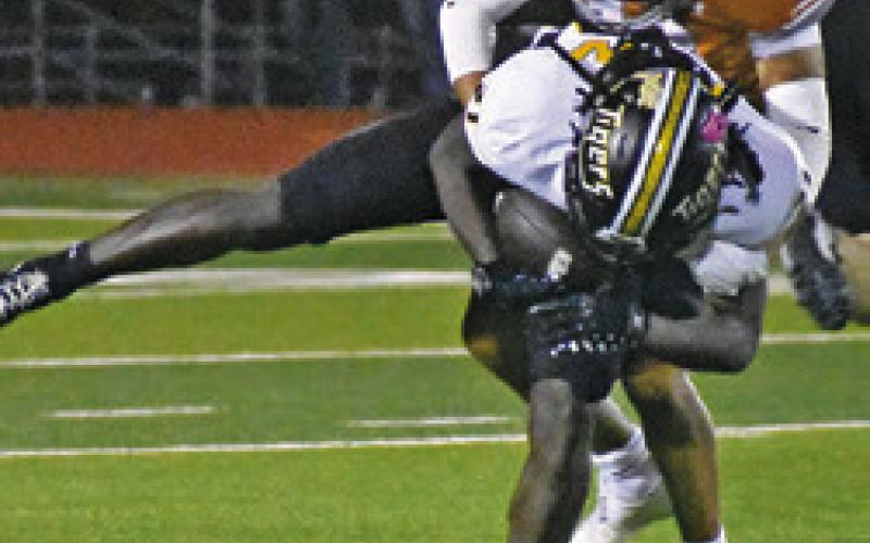 REYMON LEYVA of Caldwell tackles a Sealy player in Friday’s loss at home. Tribune photo by Roy Sanders