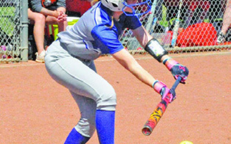 KAYLIE HOLDEN bunts the ball during the Somerville-Snook game last Tuesday. Tribune photo by Denise Squier