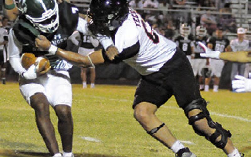 MARTIN ESPINOZA makes a tackle for Somerville.