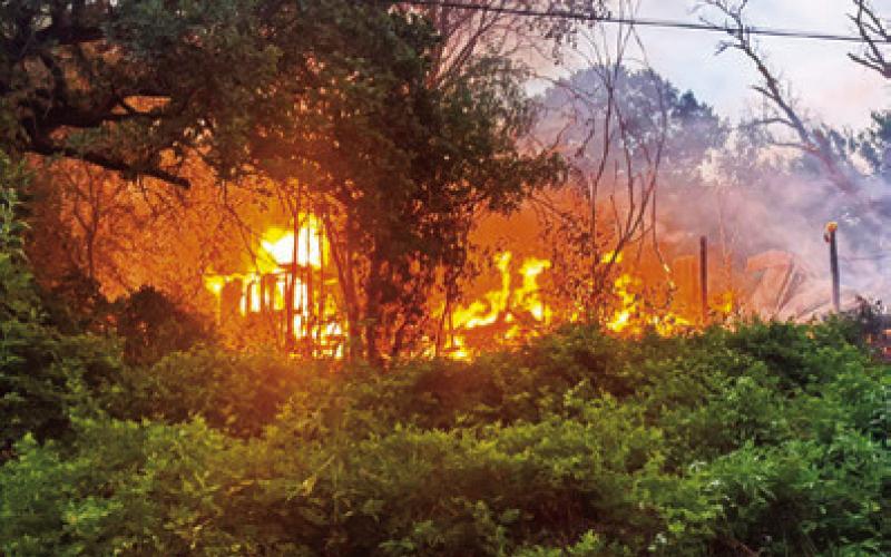 Fires destroy houses at Cade Lake