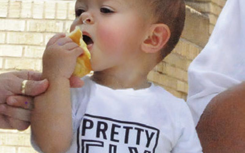 YOU ARE NEVER too young for a kolache. Tribune photo by Denise Squier