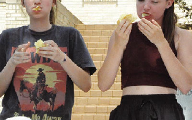 THESE KOLACHE eaters scarf them down fast during the annual eating contest. Tribune photo by Denise Squier