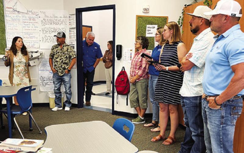 THE SNOOK SCHOOL BOARD and guests were led by Superintendent Dr. Megan Pape on a district facilities tour during Monday night’s school board meeting. Tribune photo by Denise Squier