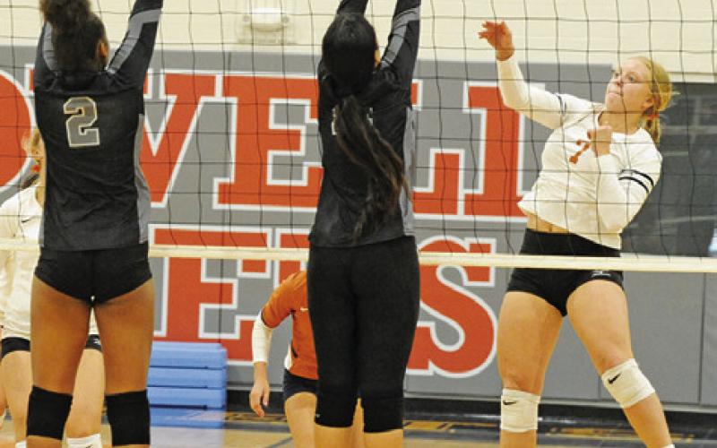 CALDWELL’S CAITLYN FAUST gets one of her five kills against Manor New Tech last Friday. -- Tribune photo by Denise Squier