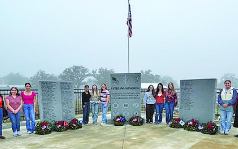 CALDWELL HIGH SCHOOL’S Young Republicans placed wreaths on graves of veterans at the Holy Rosary Cemetery. Pictured, from left, are Jim Harrell, Bree Martin, Kamryn Gomez, Gabby Quintero, Emrie Splawn, Chloe Sams, Million Dowell, Angelika Hill, Sarah Boniol, Terri Armstrong (club sponsor) and Nevonne Sempe.