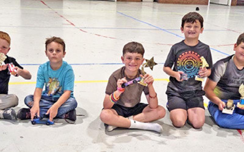 MEMBERS OF THE CUB SCOUT PACK 181 are pictured with their cars and trophies at the annual Pinewood Derby. Pictured, from left to right: Lucas Sandage, Charlie Curry, Nicholas Sandage, Asher Strouth, JakeRyan Baron. Photo courtesy of Pam Cantey