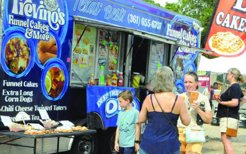 KOLACHES WERE NOT the only food on sale during the Kolache Festival. Many food vendors were selling burgers to barbecue, street corn to tacos and funnel cakes to corn dogs. Tribune photo by Denise Squier