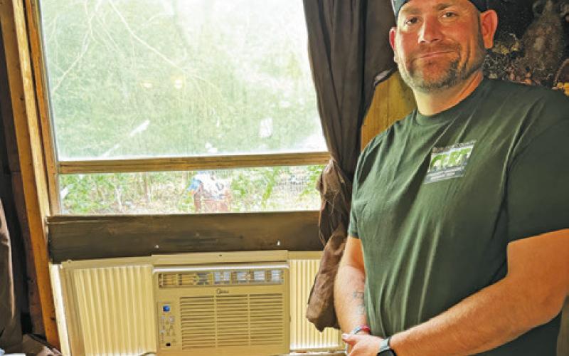 MEMBERS OF THE BURLESON COUNTY Community Emergency Response Team (CERT) installed window air conditioning units in homes in the county needing cooling. See story inside for more.