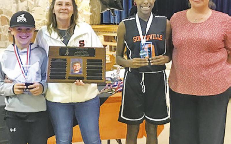 SOMERVILLE YOUTH SPORTS held its annual Fall Sports Awards Ceremony on Monday, Nov. 14, and named Hunter Knesek and Janaya Isom as the recipients of the Payton Francis Award. Also pictured are Stacy Crigler and Amber Taylor.
