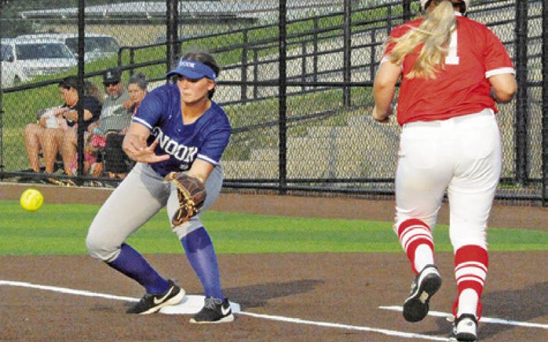 SNOOK’S ALEXIS MACIK PREPARES to catch the ball at first base during Thursday’s area game against Bremond. -- Tribune photo by Denise Squier