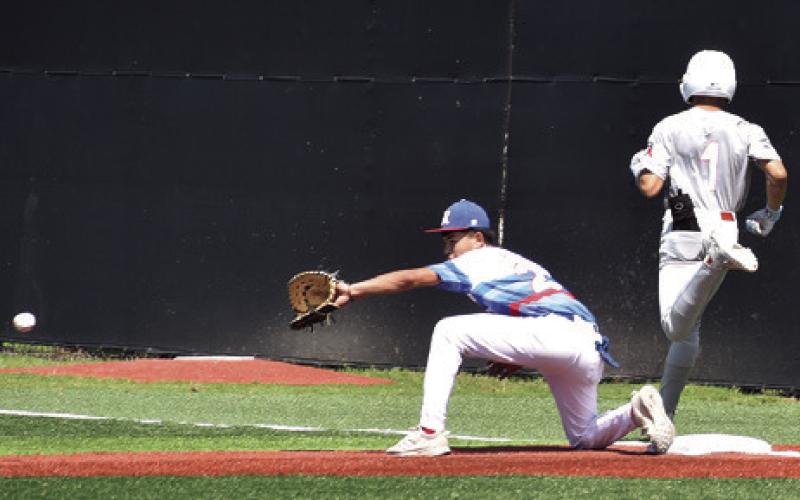 CALDWELL’S KORBIN BURNS is safe at first base against Royal. Tribune photo by Roy Sanders