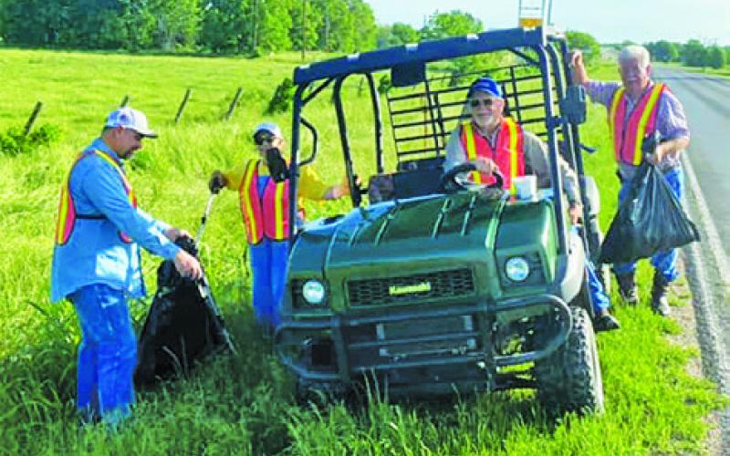 MANY VOLUNTEERS PICKED up trash and debris along roadways during last Saturday’s clean-up event in Snook.