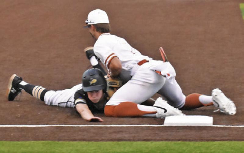 COY BECKA TAGS this Giddings base runner at third base in the Hornets’ 7-2 win. -- Tribune photo by Roy Sanders