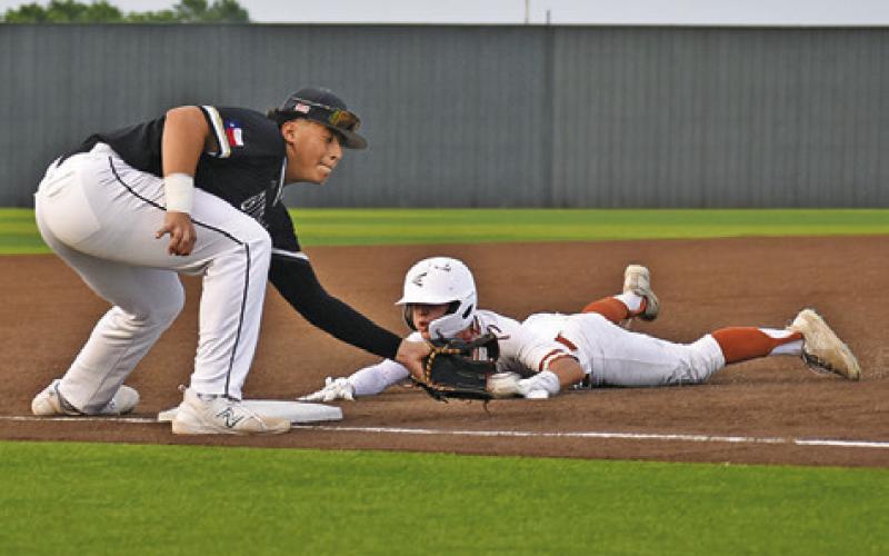 HAYS BEAVERS OF Caldwell slides into third base against Giddings. Caldwell won 7-2. -- Tribune photo by Roy Sanders