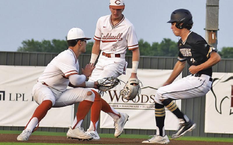 BLANE GARZA AND Ryan See move towards second base as this Giddings base runner approaches. -- Tribune photo by Roy Sanders