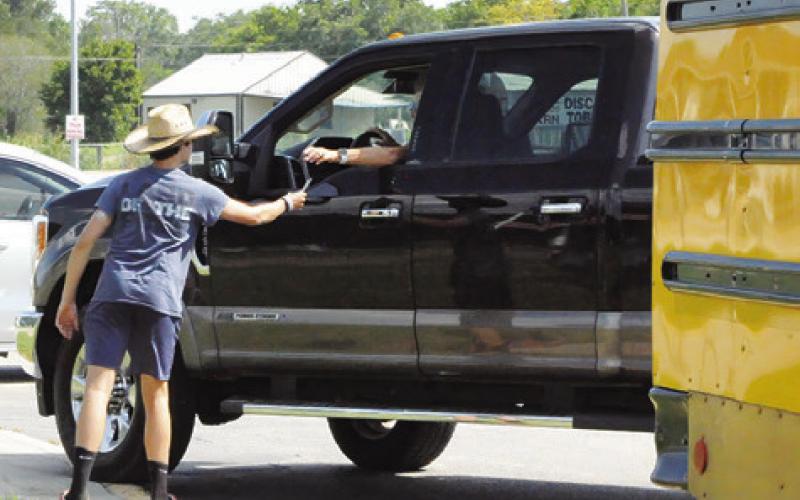 MONETARY DONATIONS WERE also accepted at Monday’s “Stuff the Bus” event, sponsored by Burleson County Cops 4Kids and the Texas A&amp;amp;M AgriLife Extension Office. Tribune photo by Denise Squier