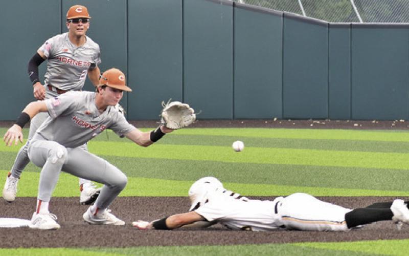SHORTSTOP RYAN SEE gets ready to catch this ball and tag the Gatesville base runner out in the Thursday game in Waco. -- Tribune photo by Roy Sanders