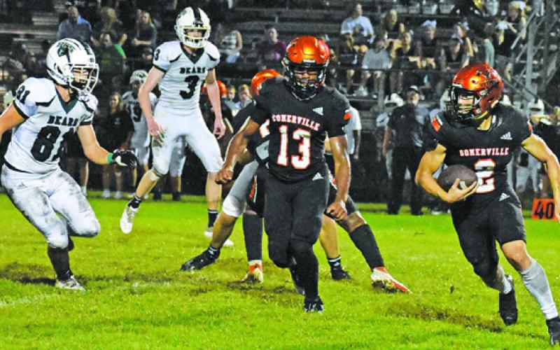 SOMERVILLE QUARTERBACK IAN Teague carries the ball as Keke Daniels gets ready to block against Brentwood Christian School. -- Tribune photo by Roy Sanders