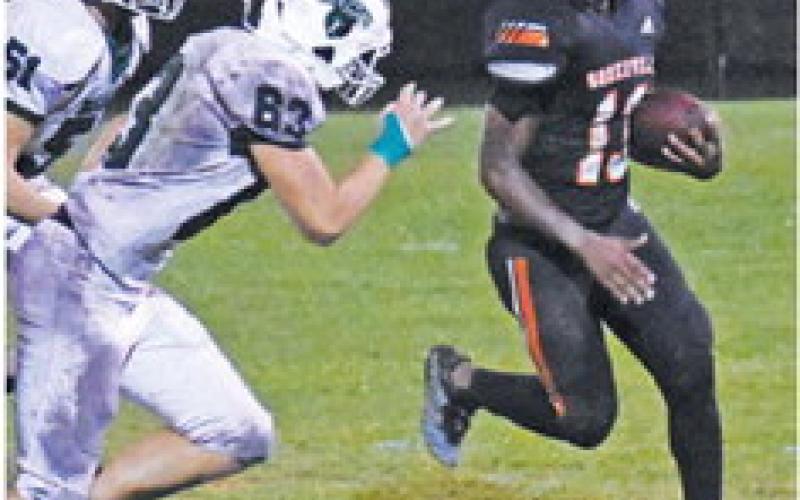 KEKE DANIELS OF Somerville carries the ball as these Brentwood Christian School defenders close in. -- Tribune photo by Roy Sanders