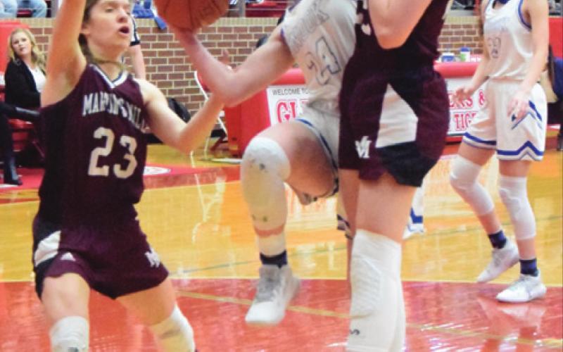 SNOOK’S JAYCIE BRISCO TRIES to shoot the ball during Snook’s state semifinal game against Martin’s Mill. The Lady Jays reaching the state semifinals was the county’s Number 3 sports story for 2021.