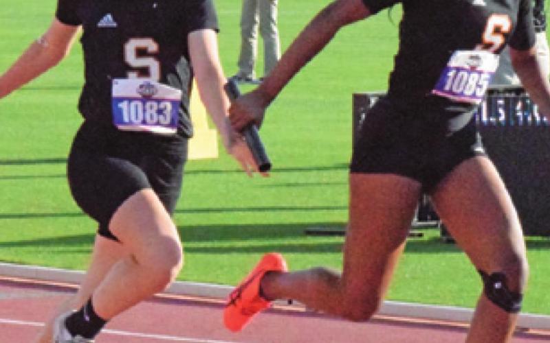 EMMA KOVASOVIC HANDS THE BATON off to Xadria Martin during the UIL Class 2A State Track &amp;amp; Field Meet. The Somerville girls’ relay team of Kovasovic, X. Martin, Ra’Maya Carter and Camia Martin made Somerville sports history as the first girls relay team to qualify for the state meet -- qualifying on the 4x200-meter and 4x100-meter relays.