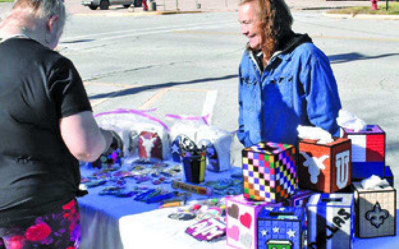 AGNES HACKNEY DISPLAYS her products on Saturday, Jan. 3, at the Farmers Market in downtown Caldwell.