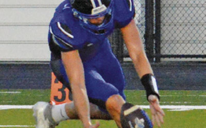 A SNOOK PLAYER reaches for the ball against NBCA. Tribune photo by Kim Hutcheson