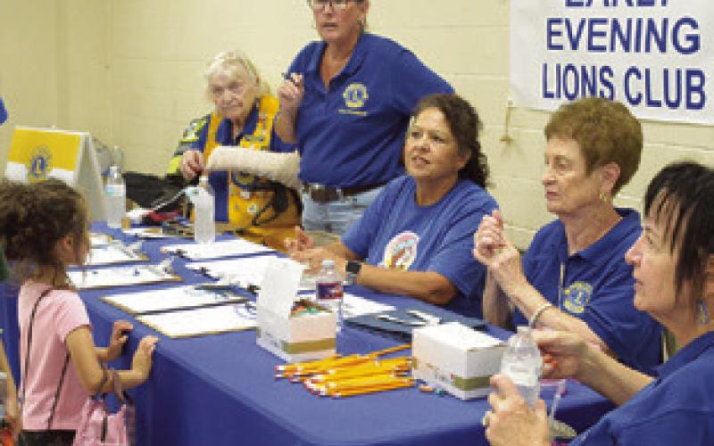 THE EARLY EVENING LIONS Club assisted at the annual Back to School Blast last Wednesday at the Burleson County Expo Center. Tribune photo by Denise Squier