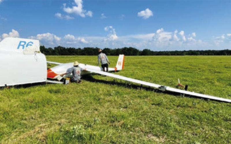 THE PILOT OF THIS glider made an emergency landing on Aug. 5 in this field off County Road 130. He was not injured.