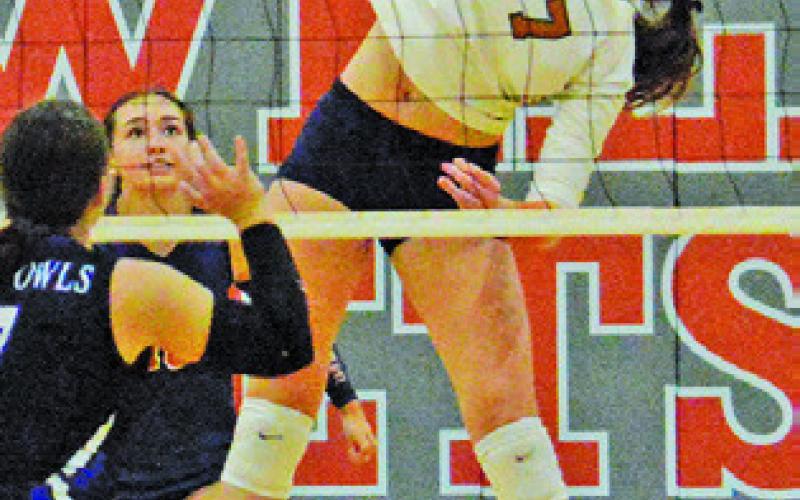 LYDIA GIESE stretches to keep the ball in play, hitting it over the net during Caldwell’s win over Anderson-Shiro on Friday. Tribune photo by Kimberly Hutcheson