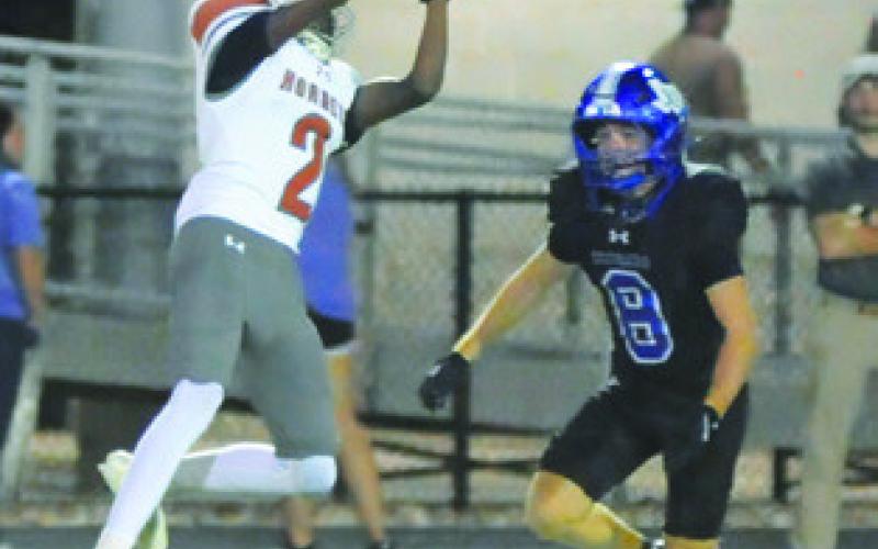 JADEN HAGAN OF Caldwell catches this pass against Jarrell. Tribune photo by Denise Squier