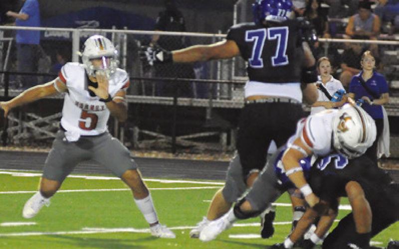 JOHN FRYREAR OF Caldwell plays quarterback for Caldwell against Jarrell. The Hornets lost 64-35. Tribune photo by Denise Squier