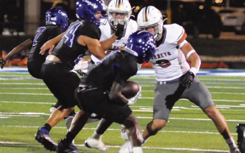 TYLER BOYD AND Shane Clements make at tackle against Jarrell last Friday in Jarrell. The Hornets lost 64-35. Tribune photo by Denise Squier