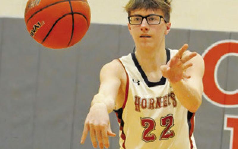 CAYDEN ZBORIL passes the ball against Smithville. -- Tribune photo by Denise Squier