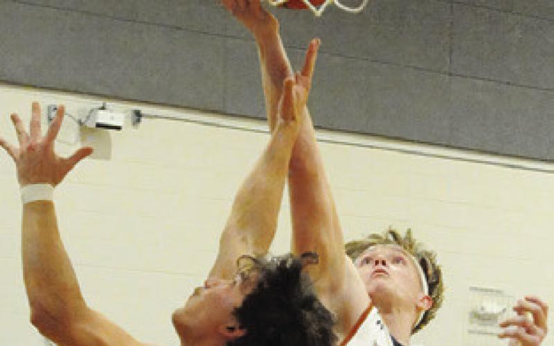 CALDWELL’S CORBIN STEWART fights for the ball against Smithville last Friday.