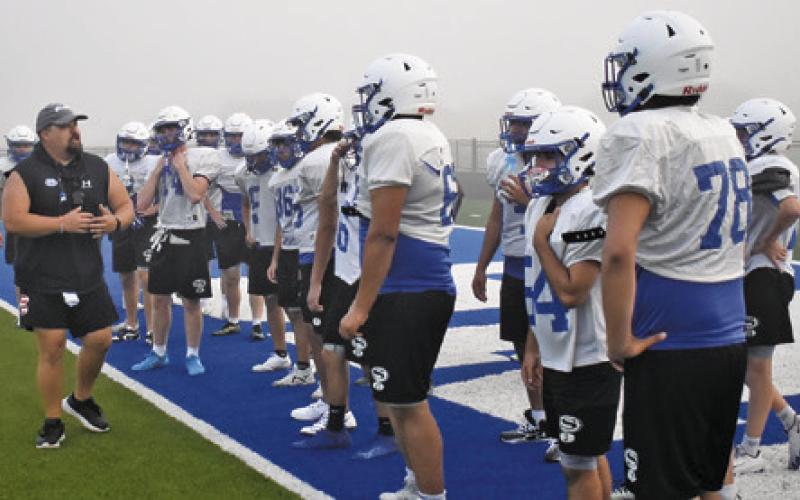 NEW SNOOK HEAD COACH Matthew Kana talks to the players during this practice session. Tribune photo by Roy Sanders