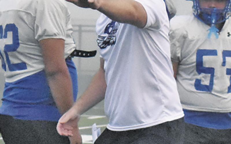 SNOOK ASSISTANT COACH Brandon Cockrell talks to the players in this practice session getting ready for the 2026 season. Tribune photo by Roy Sanders