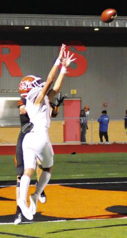CALDWELL’S DYLAN Carter intercepts a pass against Smithville last Friday in Smithville. -- Tribune photo by Denise Squier