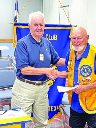 PAST DISTRICT GOVERNOR and Caldwell Men’s Club member Gordon Richardson presents a Milestone Chevron Award for 50 years of service to Clayton Myers. The award included a 50 year pin and a congratulatory letter from Lions International President Patti Hill. Photo courtesy of Robert Lee