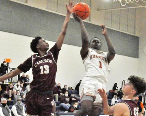 JAMAR HEWITT OF Caldwell shoots against Cameron. The Hornets lost at home 65-52. -- Tribune photo by Roy Sanders