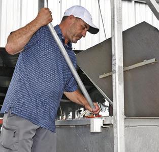 KEVIN FRITSCHE cooks on Friday at the Caldwell Education and Leadership Foundation (CELF) shrimp and crawfish dinner fundraiser at the Burleson County Expo Center. Tribune photo by Roy Sanders
