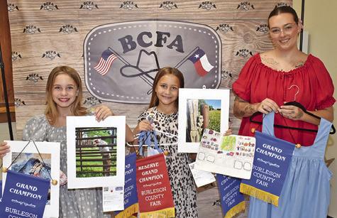HATTIE HERRMANN, left, won grand champion for fine art photography, portrait, knitting, jewelry and sewing; Heidi Herrmann, middle, won grand champion for art; and Madalyn Jennings, right, won grand champion for adult clothing.