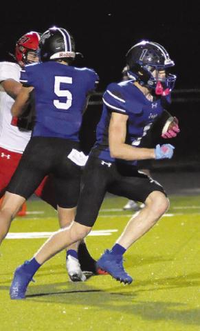 LIAM ZEQUEIRA of Snook runs with the ball against Burton last Friday. Tribune photo by Denise Squier