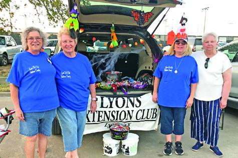 THE LYONS EXTENSION Club handed out candy to trick or treaters at Somerville’s Trunk or Treat. Pictured are Tammy Qualls-Tucker, Sharon Stevenson, Teri Sissoms and Francis Rutledge. Photo courtesy of Lyons Extension Club