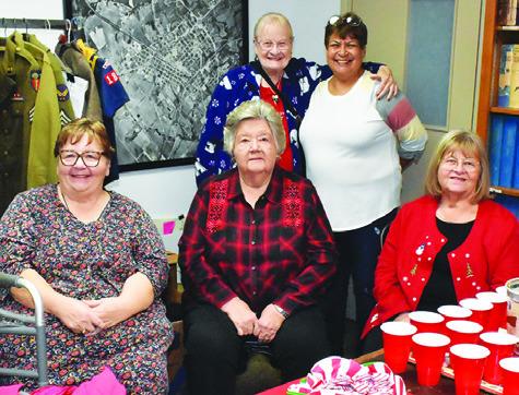 THE BURLESON COUNTY Historical Commission hosted Wassail and Cookies on Friday, Dec. 13, at the courthouse museum to celebrate the Christmas season. Pictured above are, front row, commission members Mylynda Giesenschlag, Novella Hronek and Gayla Townsend, and back row, visitors Barbara Matcek and Lenora Gonzales.
