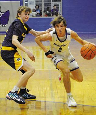 SNOOK’S BRETT Withem dribbles the ball past this Allen Academy defender. Tribune photo by Denise Squier