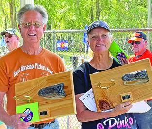 DORIS HIEDEN won the Class A 30-foot titles at the Cajun Coast Classic Horseshoe Tournament in Morgan City, Louisiana, and the doubles title at the Cajun Hi Lo Doubles on the Bayou Tournament in Patterson, Louisiana. She is pictured with doubles partner Clyde Landry.