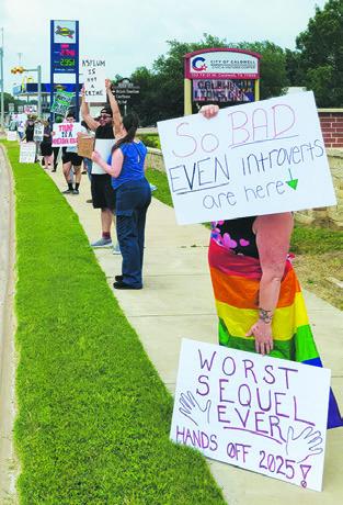 PROTESTERS WITH Burleson County Democrats, Libertarians and Independents for Action (BCDLIA) demonstrated in front of the Caldwell Civic Center on Saturday.