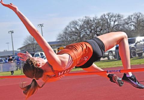 CALDWELL’S RYAN FERGUSON jumps for a bronze medal in the high jump at last week’s Koppers Relays. -- Tribune photo by Roy Sanders