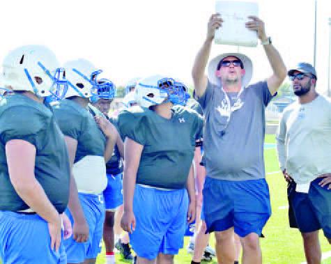SNOOK HEAD COACH Dylan Conway goes over these plays with the Snook Bluejays during the Monday, Aug. 15, practice.